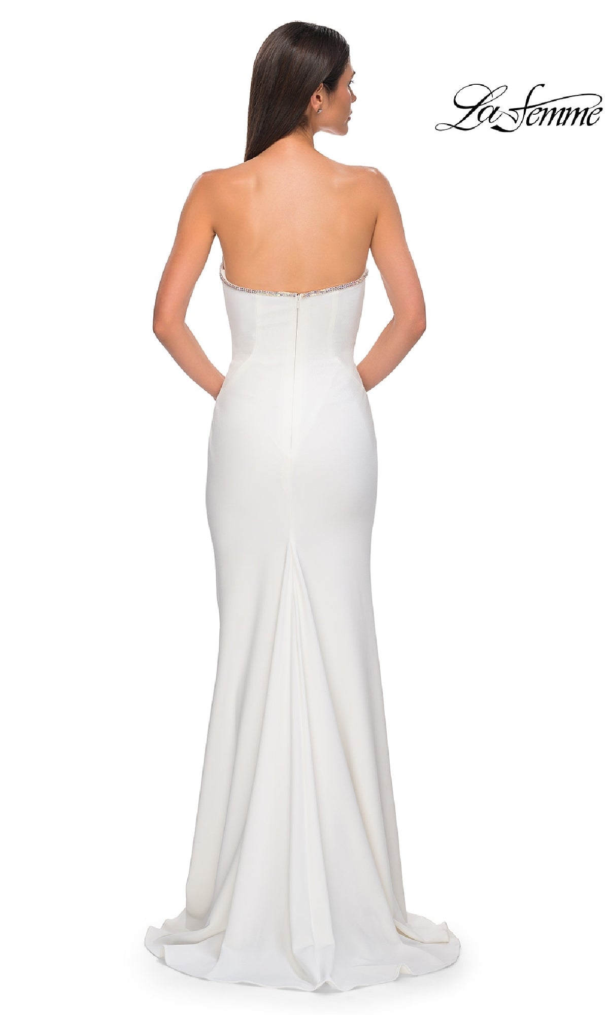 A woman is shown from the back wearing the La Femme 32854 Strapless Long Jersey Prom Dress—white, floor-length, with a fitted bodice and slight train. The La Femme logo appears in the top right corner of the image.